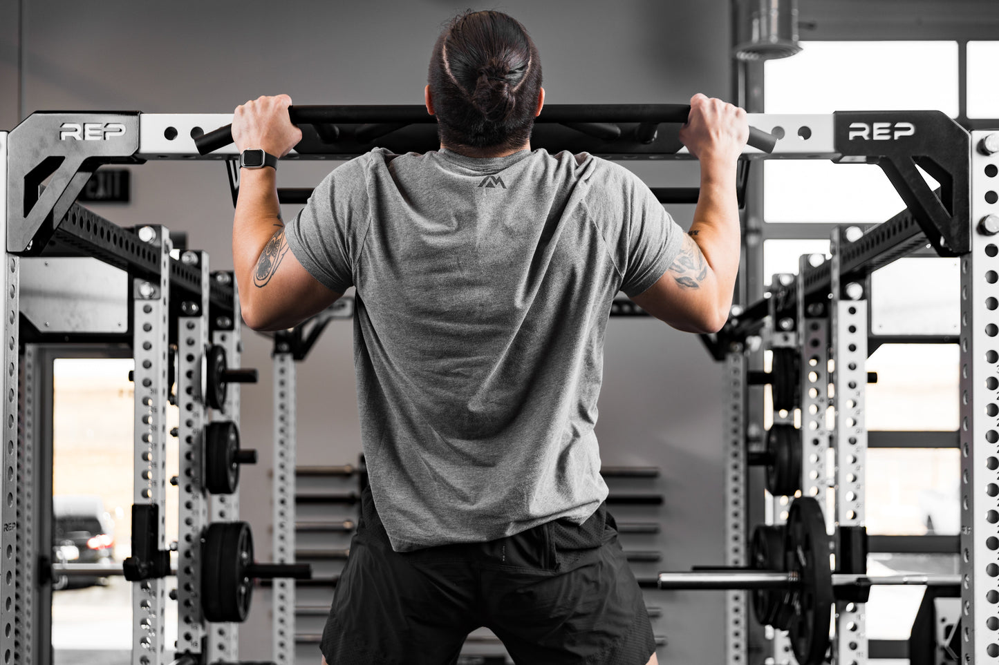 Athlete doing pull-ups on the Crossmember Multi-Grip Pull-Up Bar