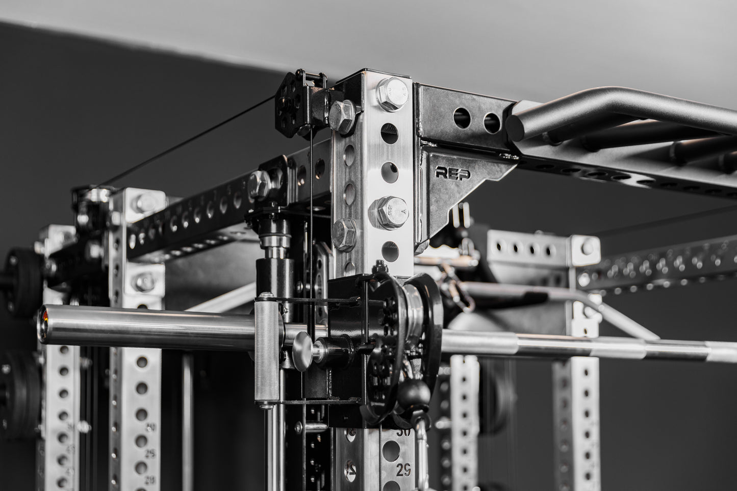 Close-up shot of the Crossmember Multi-Grip Pull-Up Bar on the front of a PR-5000 rack