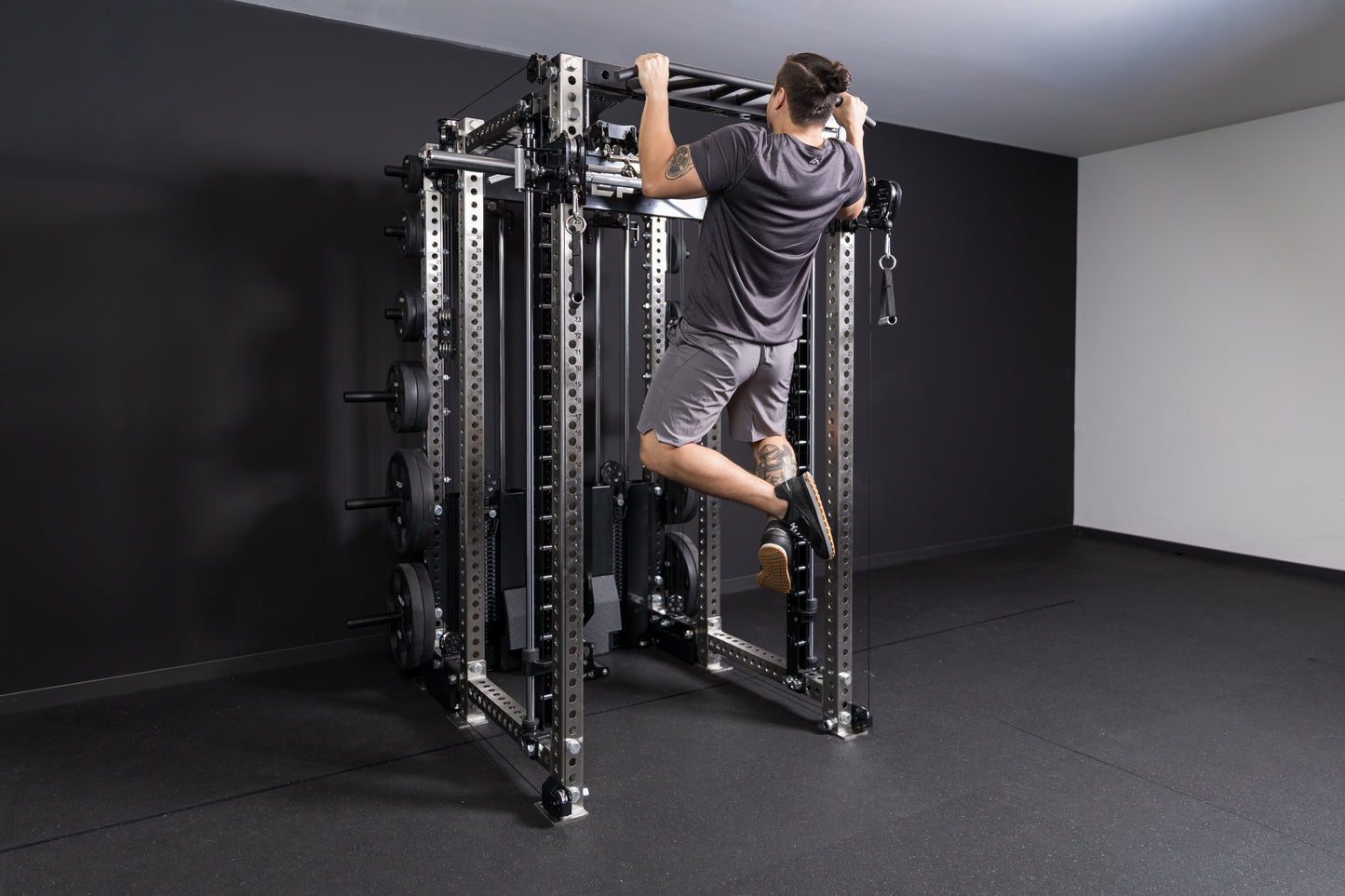 Athlete doing a pull-up on the Crossmember Multi-Grip Pull-Up Bar on the front of a PR-5000 rack