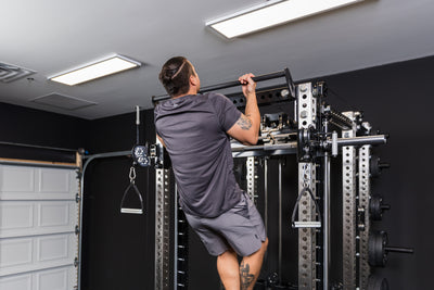 Athlete doing pull-ups on the REP Fitness Crossmember Pull-Up Bar