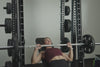Video of an athlete performing various exercise movements with the REP® Smith Machine Rack Attachment